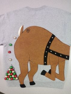 a t - shirt with an image of a pig on it's chest and christmas ornaments around the neck