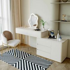 a white desk sitting next to a window in a living room on top of a hard wood floor