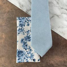 Elegant Blue Cotton Suit And Tie Accessories, Blue Cotton Tie For Formal Occasions, Classic Blue Cotton Tie, Classic Blue Cotton Handkerchiefs, Floral Tie Groomsmen, Blue Groomsmen Suits, Blue Groomsmen, Floral Pocket Square, Light Blue Suit