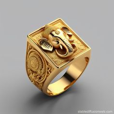 an elephant is on the side of a gold signet ring with intricate designs in it