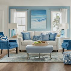 a living room with blue and white furniture