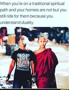 two people walking down the street with one person wearing a shirt that says, when you on a traditional ritual path & ya homes not but you still ride for them because you understand