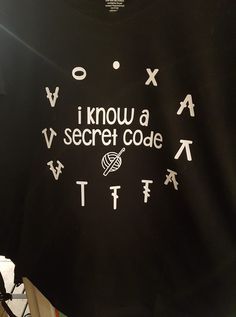 a t - shirt that says i know a secret code with letters and symbols on it