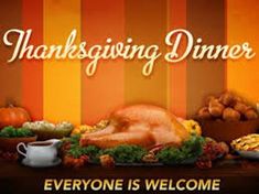 a thanksgiving dinner with turkey, stuffing and other foods on a table in front of an orange striped background