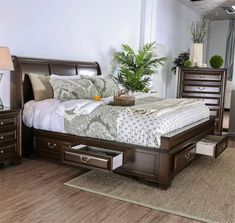 a large bed with drawers underneath it in a room