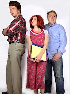 three people standing next to each other in front of a white background with one person holding a folder