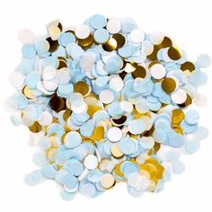 blue and gold confetti sprinkles are scattered on top of each other