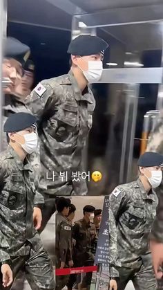 two soldiers wearing face masks walking down the street