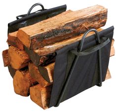 a black bag sitting on top of a pile of wood next to a stack of logs