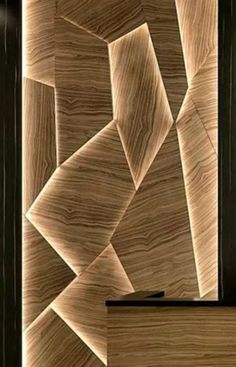 a wooden door with an abstract design on it's side and the bottom panel