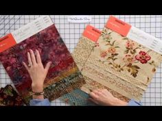 two women are working on quilts with different patterns and fabrics in front of them