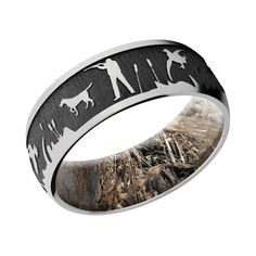 a wedding ring with an image of animals and people in the woods on it's side