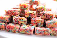 a pile of colorful sprinkles sitting on top of a white plate