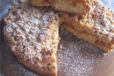 several pieces of pie on a plate covered in powdered sugar