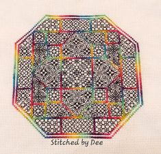 a cross - stitch pattern with the words stitched by fee in rainbow colors on it