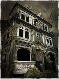 an old house with ivy growing on it's windows and balconies in the front