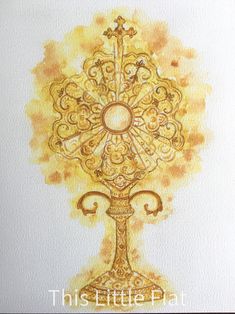 this is an image of a watercolor painting of a golden cross on white paper