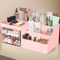 a pink desk organizer filled with cosmetics and personal care items on top of a table