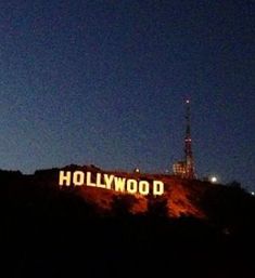 the hollywood sign is lit up at night