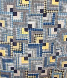 a blue and yellow quilt with squares on it