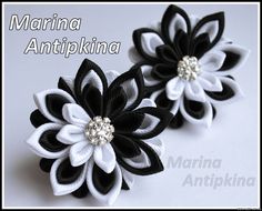 two black and white flowers with pearls on them