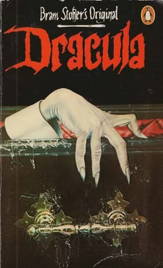 a book cover for dracula with an image of a hand reaching out from the water