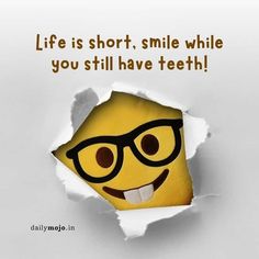 a poster with an image of a smiley face in a hole that says life is short, smile while you still have teeth