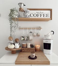 a kitchen counter with coffee cups and mugs on it