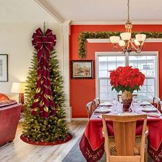 a dining room decorated for christmas with holiday decorations