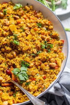 a large pan filled with rice and vegetables