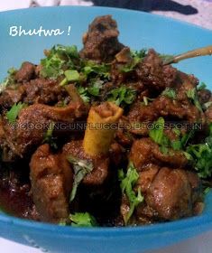 a blue bowl filled with meat and greens