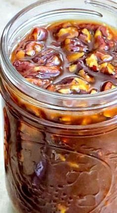 a glass jar filled with food sitting on top of a table