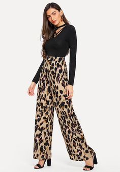 These leopard print pants bring some fabulous flare to your wardrobe. Featuring a mid-waist and fared legs with a flat front. These pants pair perfectly with a bodysuit, blouse or sweater; perfect in and out of the office. Made with a polyester blend for comfort and style. Loose Trousers Women, Leopard Trousers, Leopard Flares, Womens Palazzo Pants, Summer Pants Women, Elegant Pant, Leopard Print Pants, Leopard Pants, Korean Fashion Casual