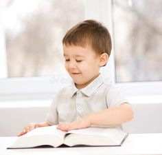 Little boy is reading a book royalty free stock images Books To Read, Education