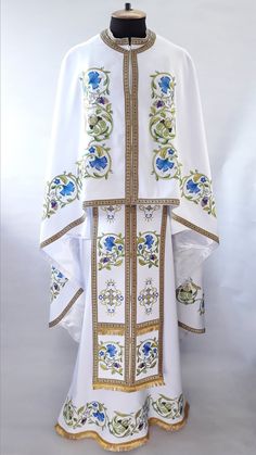 White Greek Liturgical vestment, Embroidered Priest vestment set, Greek vestment, Priest robes, Religious Clothing, Priest's robes are embroidered PLEASE be sure to indicate your height in the order notes when purchasing Embroidery type: machine embroidery Model: Ф110 The set includes: - felon (Robe) - epatrachyl (Stole) - oversleeves - belt - air cover - stichar - covering Vestment sewn from snow-white fabric and decorated with colorful machine embroidery, wide gold edge. The ornament in the fo Traditional White Embroidered Chasuble, Ceremonial Robes, Priest Outfit, Priest Robes, Small Pink Flowers, Church Attire, Embroidered Robes, Textiles Projects, Jesus Face