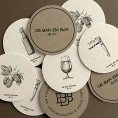 several round coasters with different types of beer and alcohol related items on them, arranged in a circle