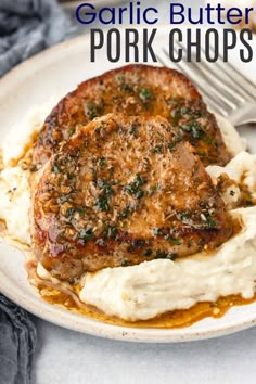 garlic butter pork chops with mashed potatoes on a plate