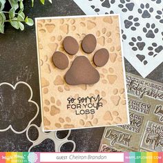 a card with an animal paw print on it and some other cards next to it