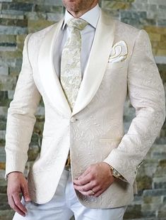 This is an Elegant Jacquard Tuxedo 2 Piece Suit by Menista crafted from high quality fabric and imported materials. Our products are handcrafted by experienced tailors who make sure the that the stitching is precise, lining is proper and the overall product is sturdy enough to not go out of shape for more than a few years. Also all our products have extra margins in their length, sleeves, sides so it's easily alterable if your size changes after some time. To see more available colours and desig Beige Tuxedo, Tuxedo For Wedding, Men Wedding Suit, Groomsmen Outfit, Ivory Suit, Paisley Jacket, Men Blazer, Mode Tips, Slim Fit Tuxedo