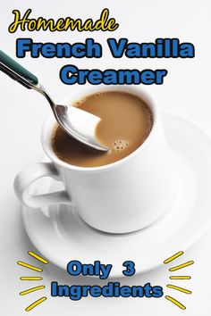 a cup of french vanilla creamer on a saucer with a spoon in it