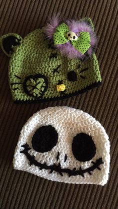 two crocheted hats that have faces on them