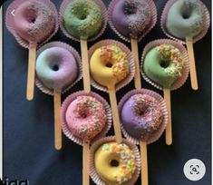 there are many doughnuts on the sticks with sprinkles in them