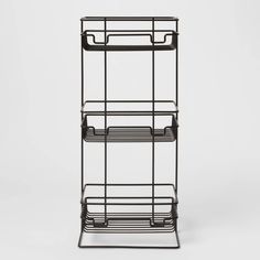 three tiered metal rack with two shelves on each side and one shelf in the middle