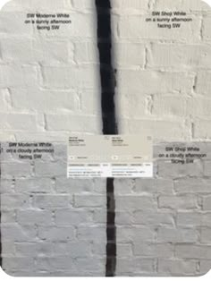 a white brick wall with some black and white lines on the side, along with instructions for how to paint it