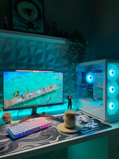 two computer monitors sitting on top of a desk in front of a keyboard and mouse