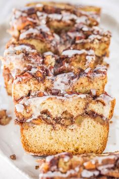 slices of cinnamon roll bread on a plate with icing drizzled over them