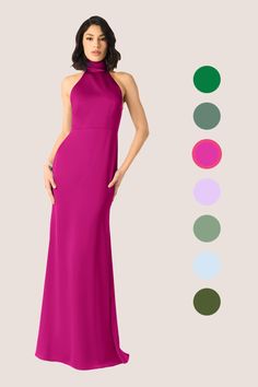 a woman in a long purple dress standing next to a color chart with different colors