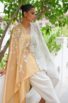 Rida Elegant Embroidered Kurta With Cape Sleeves, Wedding Palazzo Set With Embroidered Sleeves For Eid, Embroidered Blouse Piece With Cape Sleeves For Wedding, Traditional Silk Palazzo Set With Cape Sleeves, Silk Kaftan With Dupatta For Wedding, Designer Embroidered Kurta With Cape Sleeves, Elegant Off White Palazzo Set With Traditional Drape, Embroidered Sets With Cape Sleeves For Summer, Embroidered Summer Sets With Cape Sleeves