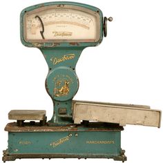 an old fashioned mechanical scale on a white background