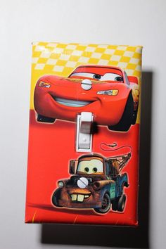 a disney pixar light switch cover with cars on it